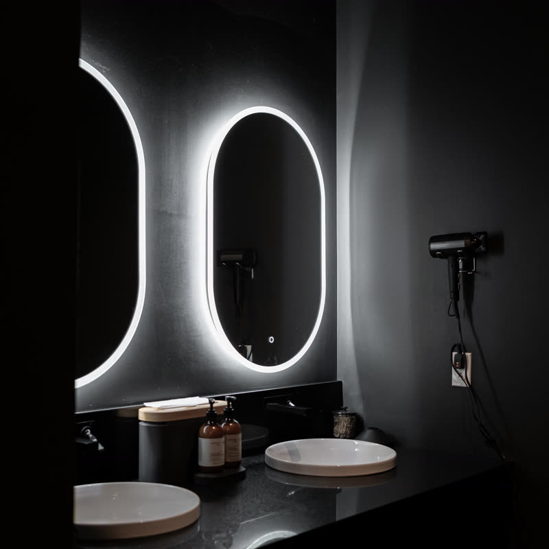 The SHĀB changing room with backlit mirrors and sinks